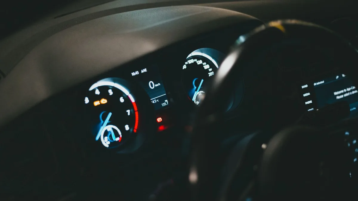 Instrument cluster showing an adaptive cruise control status icon
