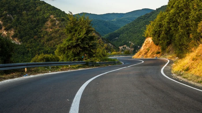 Adaptive Cruise on Hills and Curves