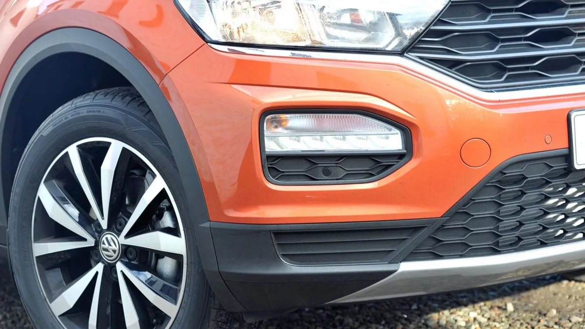 Close-up of a front bumper radar sensor module removed for replacement