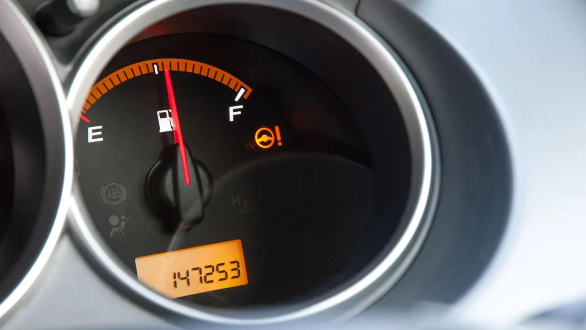 Amber driver assist warning symbol lit on a vehicle dashboard