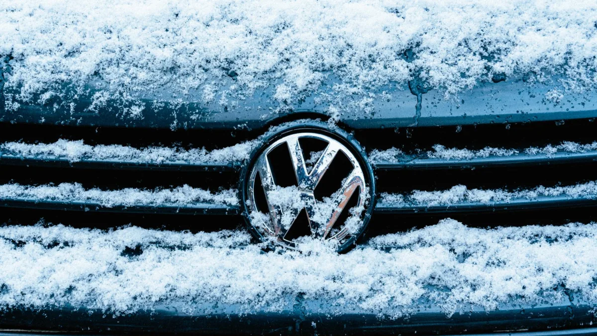 Snow and slush packed into a car front grille covering the radar sensor