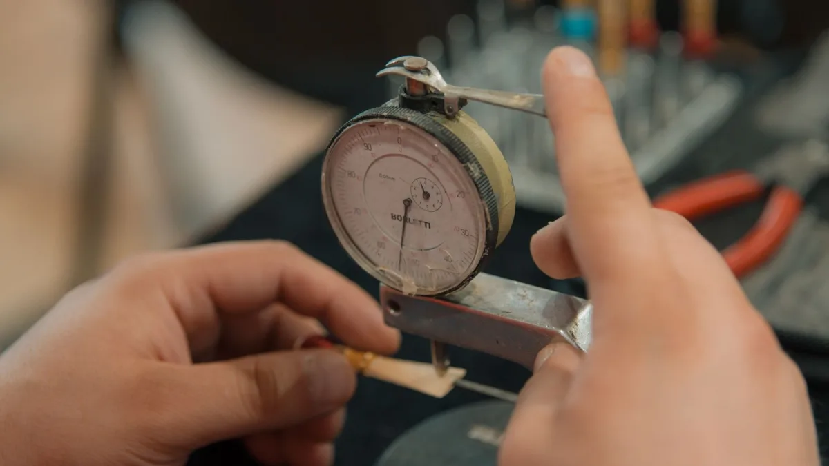 Technician performing a camera calibration on a newly installed windshield