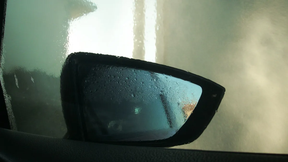 Backup camera lens showing internal fog and water droplets trapped behind the glass