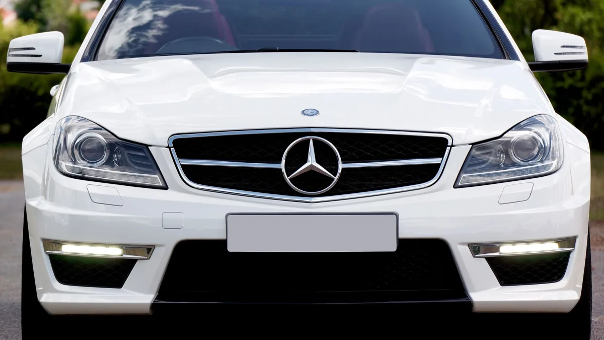 Front bumper area showing the radar sensor panel behind a manufacturer emblem