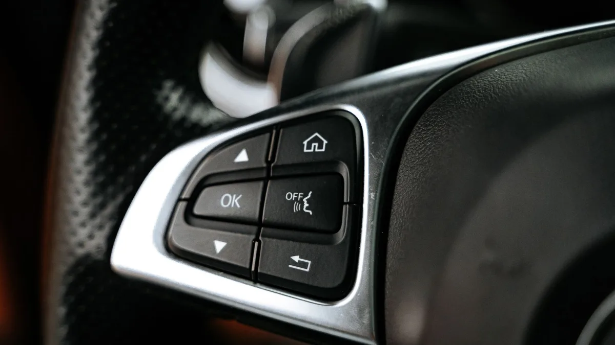 Steering wheel spoke buttons including a lane keep assist toggle