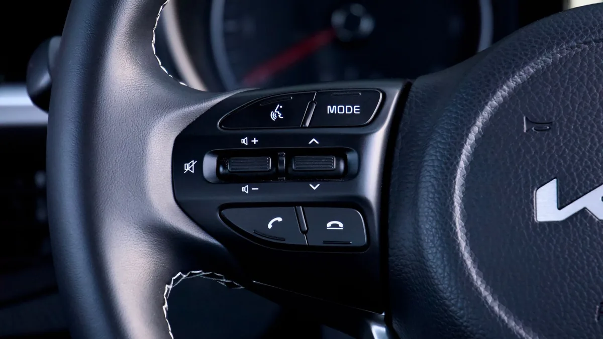Steering wheel button cluster and lane assist indicator in a Kia