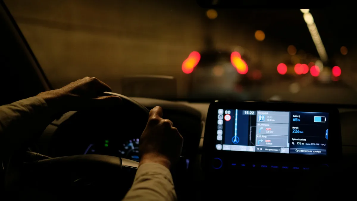 Driver keeping both hands on the wheel while lane assist is active