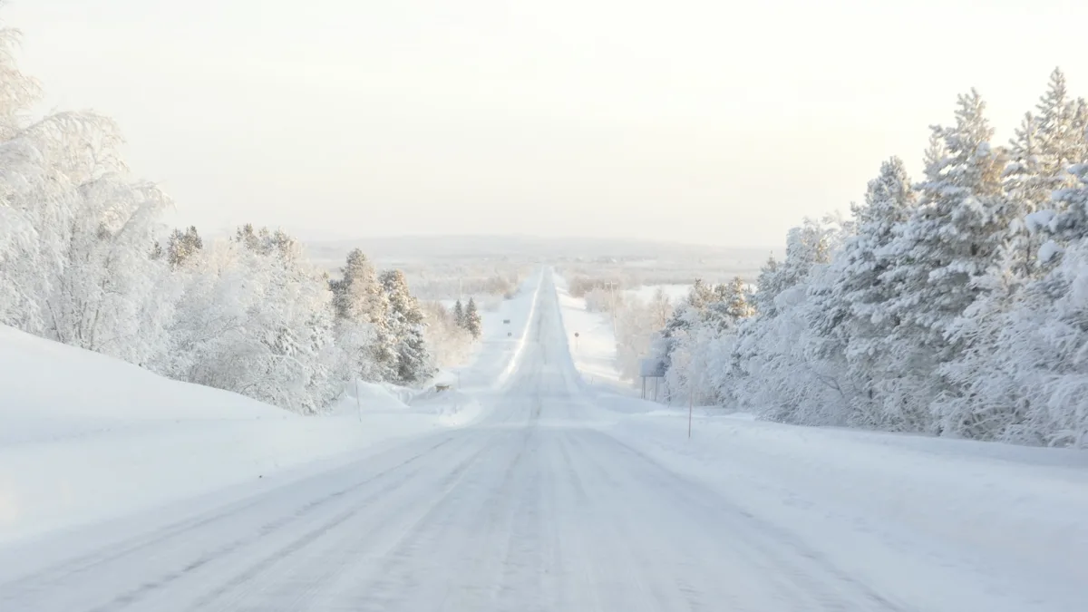 Highway lane markings buried under fresh snow in winter