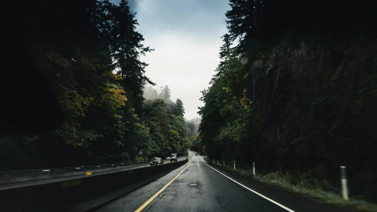 Driver keeping hands on the wheel while a lane alert appears on the dash
