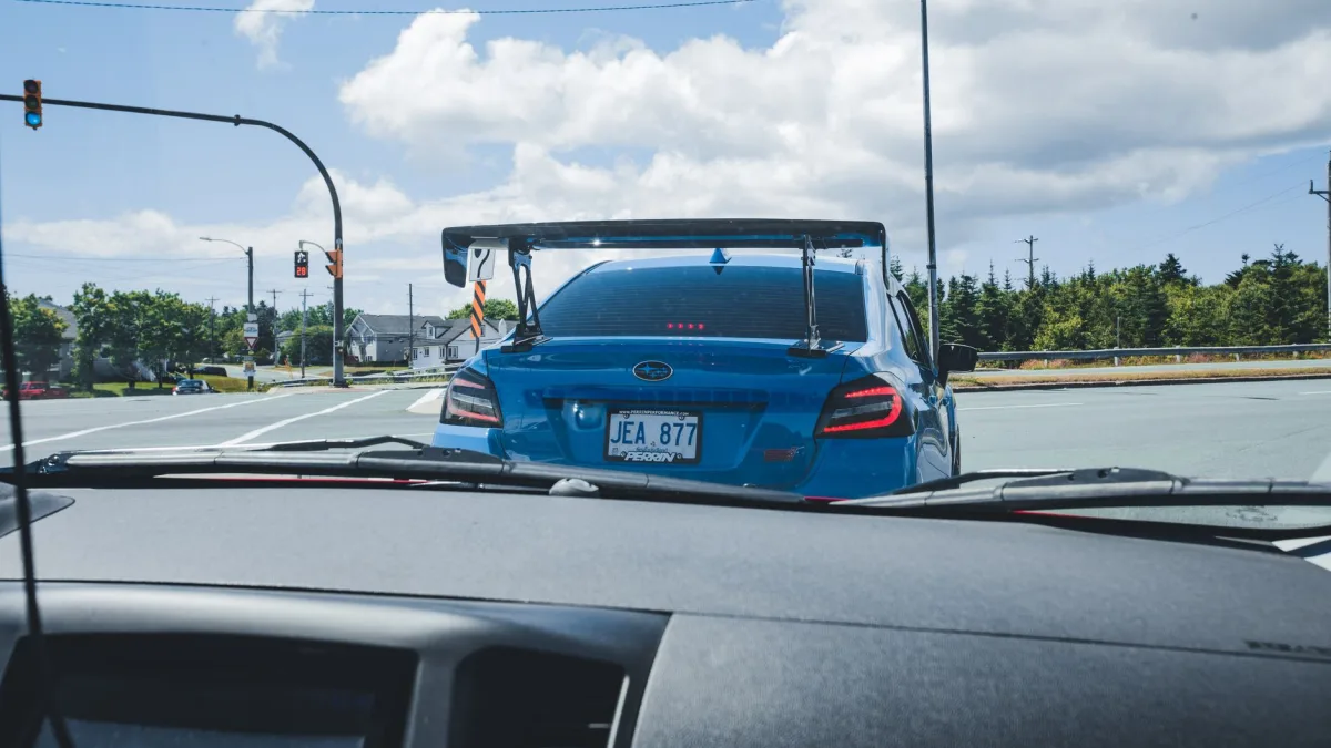 Twin EyeSight camera housings mounted at the top of a Subaru windshield