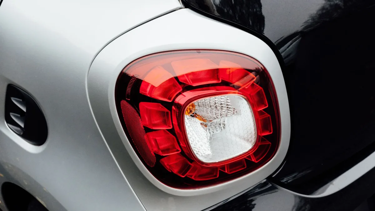 Row of ultrasonic parking sensors set into a rear bumper