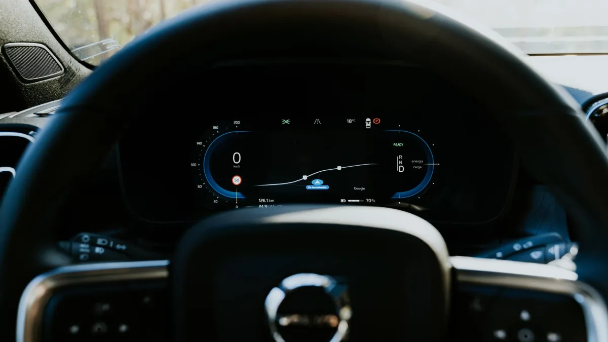 Volvo driver display showing the City Safety braking indicator between the gauges